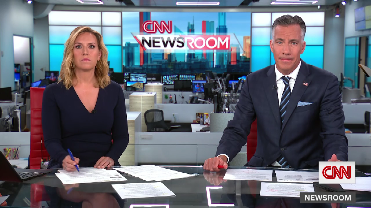 CNN anchors reporting news in studio